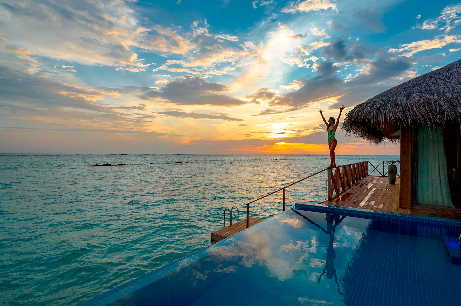 Luxury overwater bungalows at sunset